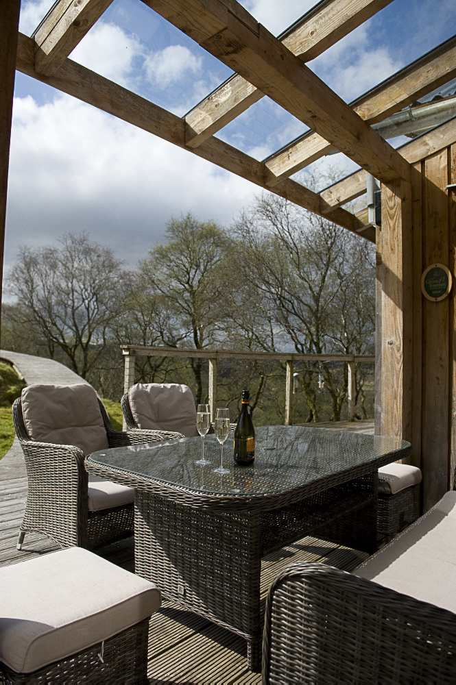 Veranda with covered outdoor seating and table, Sithean - environmentally sensitively constructed, high quality Self-catering holiday accommodation. Glen Lonan, Taynuilt, near Oban, Argyll, Scottish highlands, Scotland 

C180507NF5D0107-10S0